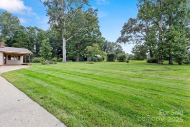 Well-maintained home on a spacious 3.28 acre corner lot in the