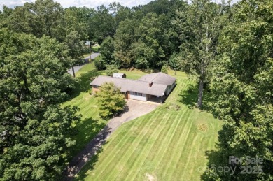 Well-maintained home on a spacious 3.28 acre corner lot in the