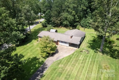 Well-maintained home on a spacious 3.28 acre corner lot in the
