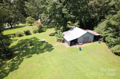 Well-maintained home on a spacious 3.28 acre corner lot in the