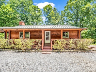 Tucked among the trees in the desirable Riverbend community of - photo 1