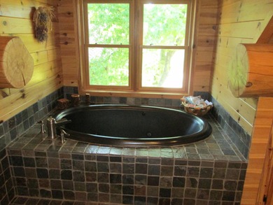 Is Golf your Game? This stunning full log home is perfect for - photo 35