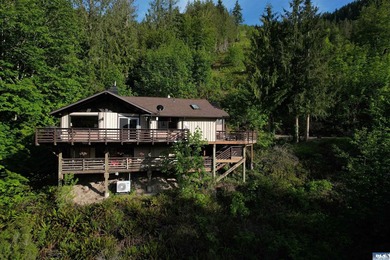 Set on over 5 private acres, this distinctive 2270sf home blends - photo 2