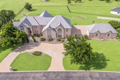 Welcome home to this magnificent estate nestled within the gated - photo 1