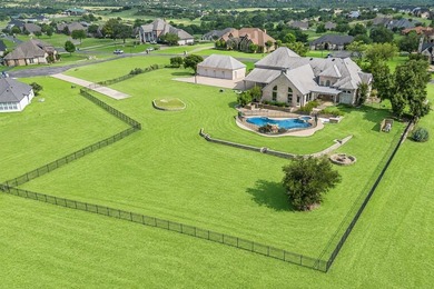 Welcome home to this magnificent estate nestled within the gated - photo 2