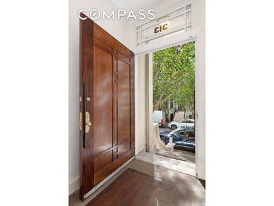 Welcome to this exceptional renovated limestone townhouse at 313 - photo 2