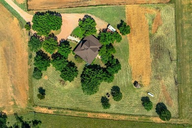 Boasting Nine Active Wells, this +/- 100 acre legacy ranch, just - photo 17
