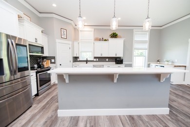 Nestled on 1.58 acres in a gated waterfront community, this - photo 21