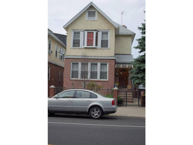 Proudly presenting a fully detached brick two-family home - photo 1