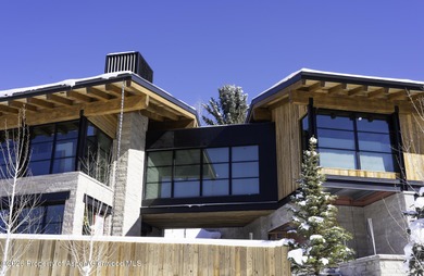 Stroll to town from this 5 bedroom 6 1/2 bath stunner created by