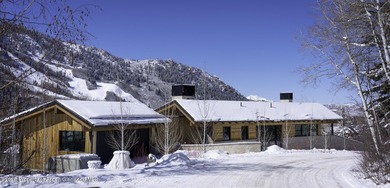 Stroll to town from this 5 bedroom 6 1/2 bath stunner created by