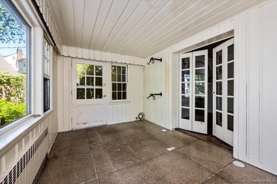 Welcome to this sun-drenched and charming Tudor-style residence - photo 10