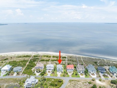 Experience beachfront living like no other at this