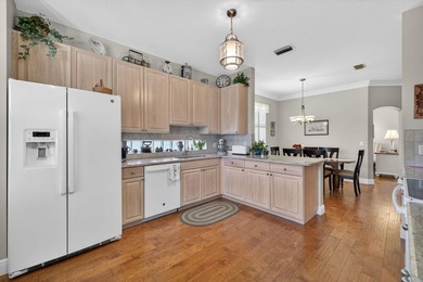 Situated on a large corner lot with lush tropical landscaping - photo 11