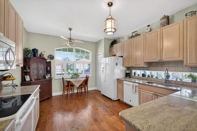 Situated on a large corner lot with lush tropical landscaping - photo 13