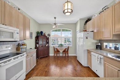 Situated on a large corner lot with lush tropical landscaping - photo 14