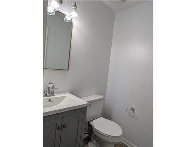 Fully renovated ranch with a daylight basement. Arrive at a