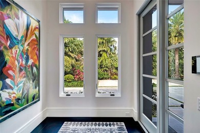 Located in Riomar Bay II, this 3 BD/4.5 BA residence blends - photo 5