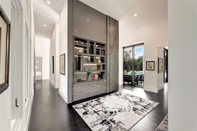 Located in Riomar Bay II, this 3 BD/4.5 BA residence blends - photo 6