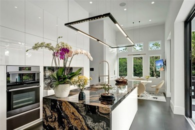 Located in Riomar Bay II, this 3 BD/4.5 BA residence blends - photo 7