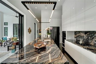 Located in Riomar Bay II, this 3 BD/4.5 BA residence blends - photo 9