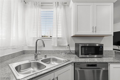 Welcome to this unique corner-unit townhome that seamlessly