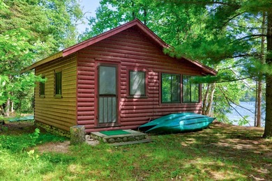 Discover your perfect escape on Mantrap Lake, one of the area's - photo 2