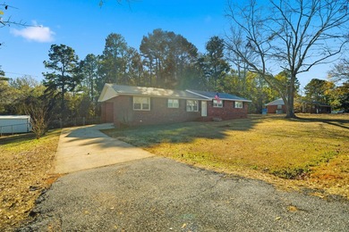Welcome home to the charming 3-bedroom, 2-bath brick ranch on a