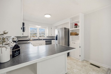 Welcome home to the charming 3-bedroom, 2-bath brick ranch on a