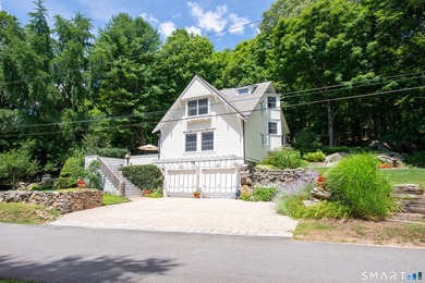 Privately set on over three picturesque acres in Deep River