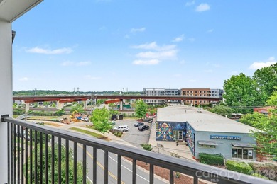 Perched on the top floor of one of NoDa's most coveted addresses - photo 9