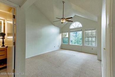 This two-story condo has high vaulted ceilings, skylights, and a - photo 22