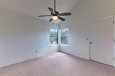 This two-story condo has high vaulted ceilings, skylights, and a - photo 30