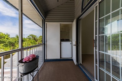 This two-story condo has high vaulted ceilings, skylights, and a - photo 43