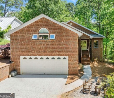 Lake Home For Sale in Flowery Branch, Georgia