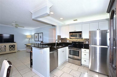 RARE FIND...1st Floor remodeled 2 Bed/2 Bath partially furnished - photo 8