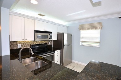 RARE FIND...1st Floor remodeled 2 Bed/2 Bath partially furnished - photo 9