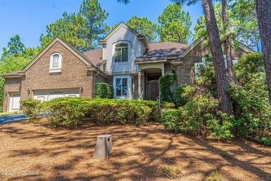 Located in the Pinehurst No. 6 neighborhood, this custom-built - photo 2