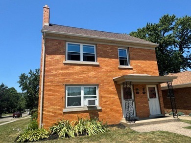Beautiful brick two unit near the VA that has a two-car detached - photo 1