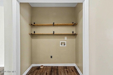 New roof, new LVP (no carpet!), and fresh paint welcome you home - photo 11