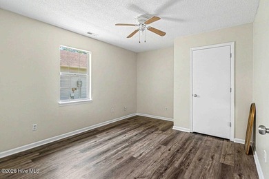 New roof, new LVP (no carpet!), and fresh paint welcome you home - photo 12