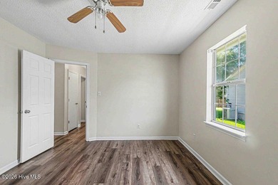 New roof, new LVP (no carpet!), and fresh paint welcome you home - photo 13