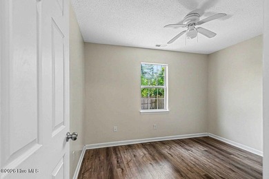New roof, new LVP (no carpet!), and fresh paint welcome you home - photo 15