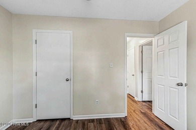 New roof, new LVP (no carpet!), and fresh paint welcome you home - photo 16
