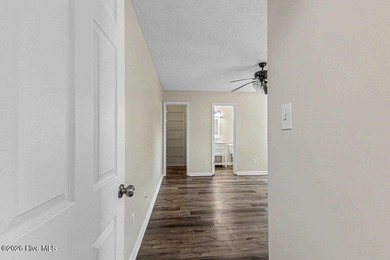 New roof, new LVP (no carpet!), and fresh paint welcome you home - photo 17
