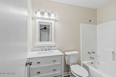 New roof, new LVP (no carpet!), and fresh paint welcome you home - photo 21