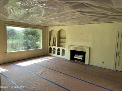 Lakefront views and exceptional privacy on a 1.4-acre lot can be - photo 11