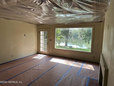 Lakefront views and exceptional privacy on a 1.4-acre lot can be - photo 13