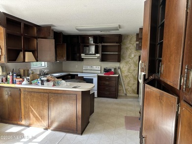Lakefront views and exceptional privacy on a 1.4-acre lot can be - photo 16