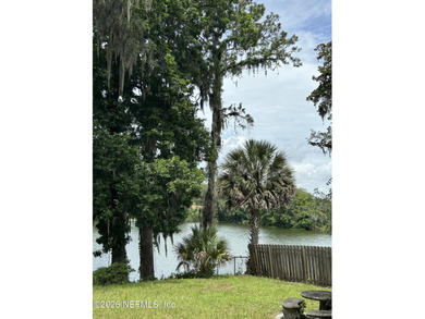 Lakefront views and exceptional privacy on a 1.4-acre lot can be - photo 19